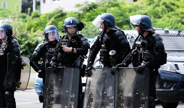 French riot police at the entrance of the Vallee-du-Tir district, in Noumea on MAY 2024. (AFP)