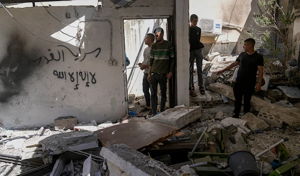 Palestinians inspect the damage in Al Fara'a refugee camp in the occupied West Bank following an Israeli military raid, on June 10, 2024. (AP)