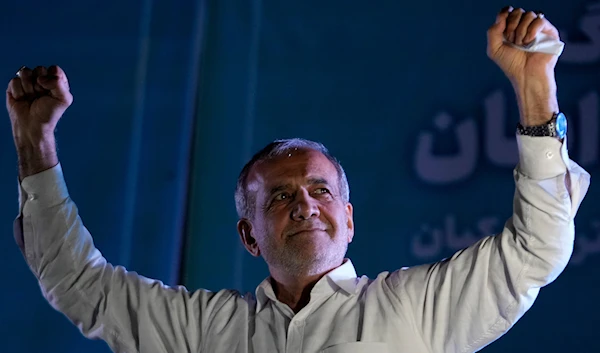 Reformist candidate for the Iran's presidential election Masoud Pezeshkian clenches his fists during a campaign rally in Tehran, Iran, on July 3, 2024. (AP)