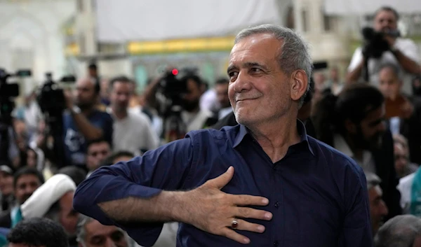 Iran's President-elect Masoud Pezeshkian greets his supporters in a meeting a day after the presidential election, at the shrine of the late revolutionary founder Ayatollah Khomeini, just outside Tehran, Iran, July 6, 2024 (AP)