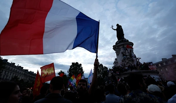 People gather on the Republique plaza following the second round of the legislative elections, Sunday, July 7, 2024 in Paris. (AP)