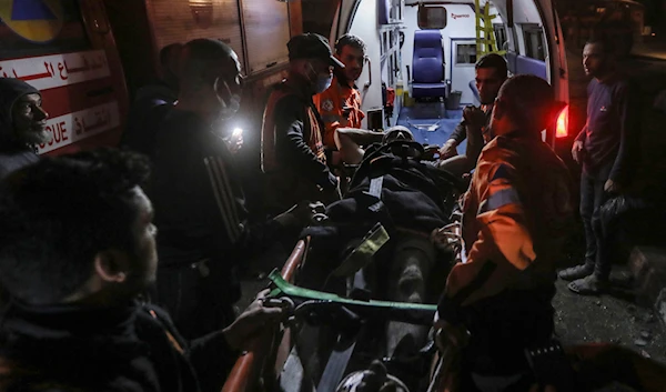 Palestinian medics evacuate a wounded youth after Israeli bombardment of the Gaza Strip, by ambulance to the Hospital in Rafah, southern Gaza Strip, occupied Palestine, May 4, 2024 (AP)