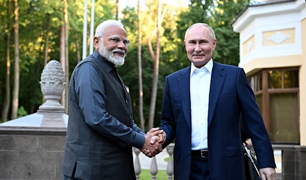 India Prime Minister Narendra Modi, left, and Russia President Vladimir Putin shake hands during an informal meeting at Novo-Ogarevo state residence, outside Moscow, Russia, July 8, 2024. (AP)