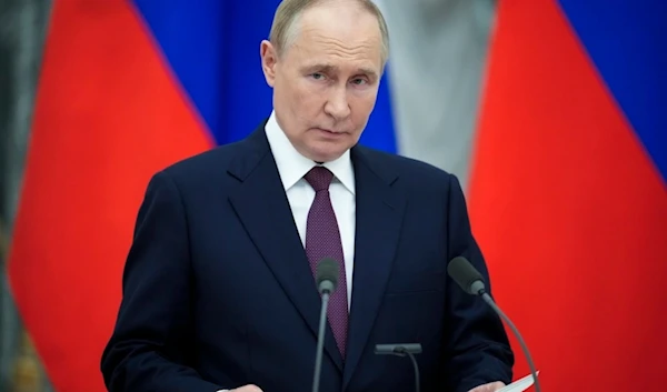 Russian President Vladimir Putin reads his press statement after the talks with Hungarian Prime Minister Viktor Orban in the Kremlin in Moscow, Russia, Friday, July 5, 2024. (AP)