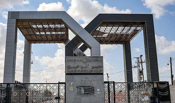 This picture taken on October 19, 2023 shows the closed gate to the Rafah border crossing with Egypt, in the southern Gaza Strip. (AFP)