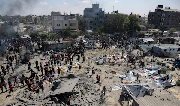 Palestinians inspect the damage at a site hit by an Israeli bombardment on Khan Younis, southern Gaza Strip, Saturday, July 13, 2024. (AP)