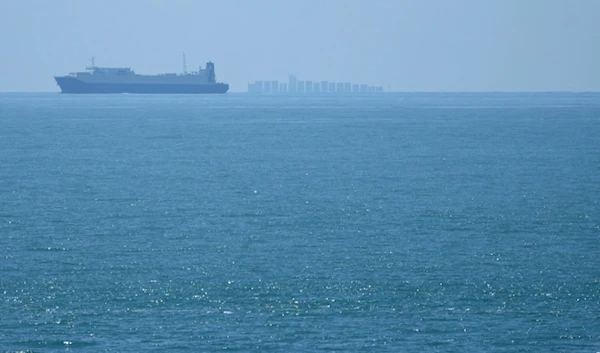 Ships move through the Taiwan Strait as seen from the closest point in mainland China to the island of Taiwan, in Pingtan in southeastern China's Fujian Province, on Aug. 5, 2022 (AP)