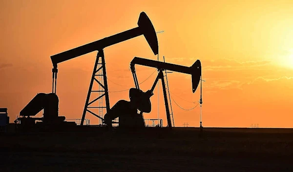 Pump jacks extract oil from beneath the ground in North Dakota, May 19, 2021. (AP)