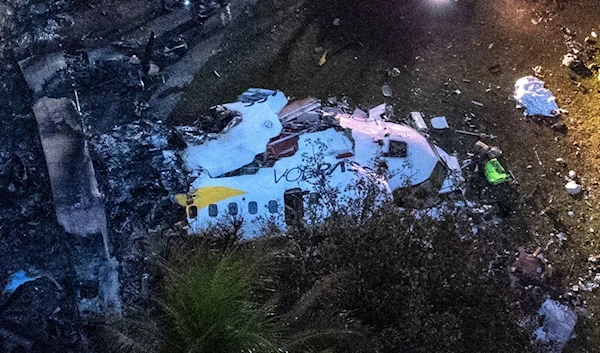 Aerial view of the wreckage of an airplane that crashed with 61 people on board in Vinhedo, Sao Paulo State, Brazil, August 9, 2024. (AFP)