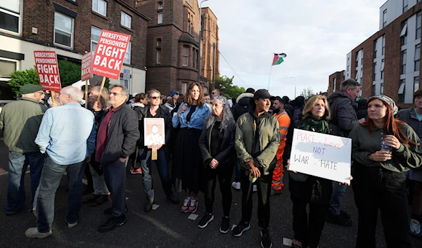 Counter protestors gather in Liverpool, on August 7, 2024. (AP)