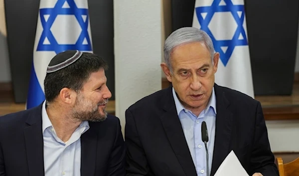 Israeli Prime Minister Benjamin Netanyahu, right, speaks with Finance Minister Bezalel Smotrich during the weekly cabinet meeting at the Security Ministry in Tel Aviv on Sunday, January, 7, 2024. (AP)