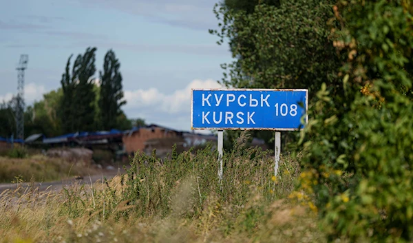 A plate with sign "Kursk 108 km" is seen on the Russian-Ukrainian border in Sumy region, Ukraine, Tuesday, August 13, 2024 (AP)