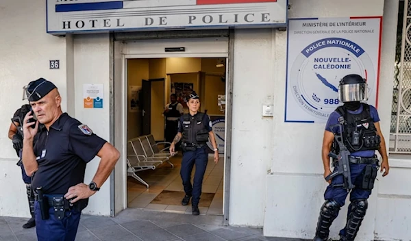 Police wait for the arrival of French President Emmanuel Macron at the central police station in Noumea, New Caledonia Thursday, May 23, 2024. (AP)