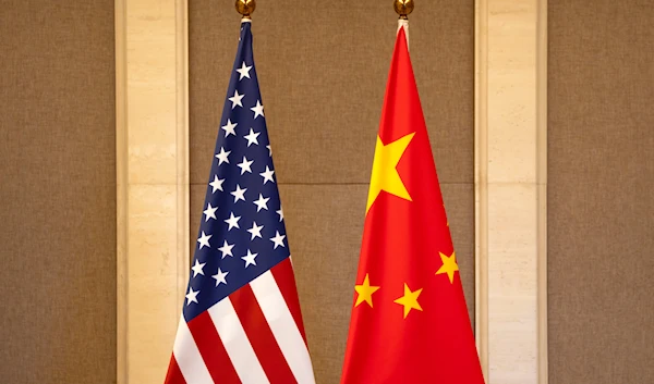 U.S. and Chinese flags are set up at the Diaoyutai State Guesthouse in Beijing, on July 8, 2023. (AP/Pool)