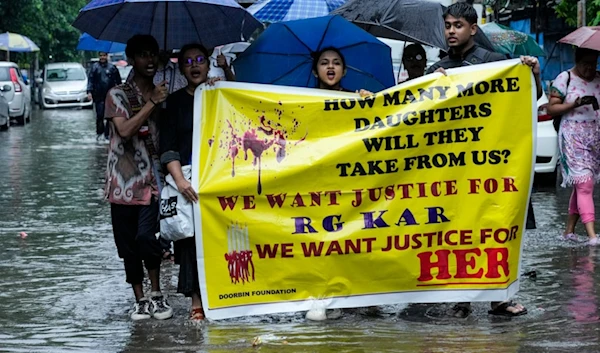 Members of West Bengal Junior Doctors' Front and nursing students shout slogans  during a protest against the rape and killing of a trainee doctor at a government hospital in Kolkata last week, in Kolkata, India, Sunday, Aug. 18, 2024. (AP)