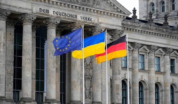 The European Union, the Ukrainian and the German flags flutter at the German parliament, Bundestag, outside the Reichstag Building in Berlin, Germany, June 11, 2024. (AP)