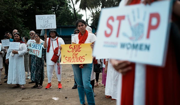 Indians protesting against the rape and killing of a trainee doctor at a government hospital in Kolkata, hold placards in Mumbai, India, Monday, August 19, 2024 (AP)