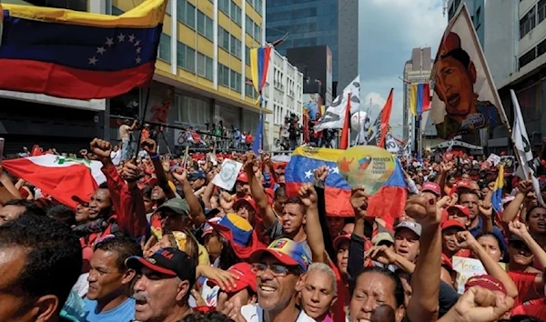 Supporters of Venezuelan Nicolas Maduro take part in a rally against the secretary general of the Organization of American States (OAS) in Luis Almagro in Carcas on March 28, 2017. (AFP)