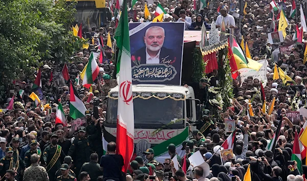 A truck carries the coffins of Hamas leader Ismail Haniyeh and his bodyguard during their funeral ceremony at Enqelab-e-Eslami Sq. in Tehran, Iran, Aug. 1, 2024. (AP)