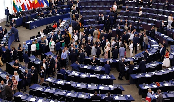 Members of European Parliament enter the plenary chamber as they prepare to vote at the European Parliament in Strasbourg, eastern France, Thursday, July 18, 2024. (AP)