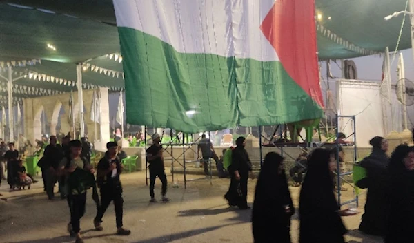 A Palestinian flag hangs over a tent in Iraq's Karbala during the commemoration of the Arbaeen, August 20, 2024 (Social media)