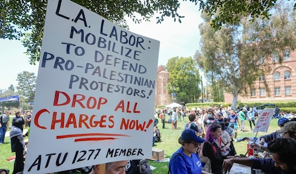 UCLA workers, students, and supporters get lunch after a rally at Royce Quad in the University of California, Los Angeles, UCLA campus Tuesday, May 28,2024. (AP)