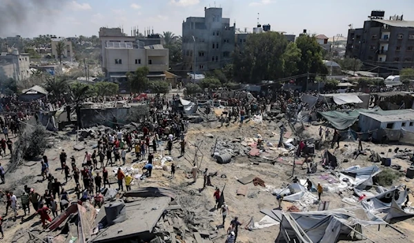 Palestinains inspect the damage at a site hit by an Israeli bombardment on Khan Younis, southern Gaza Strip, July 13,2024. (AP)