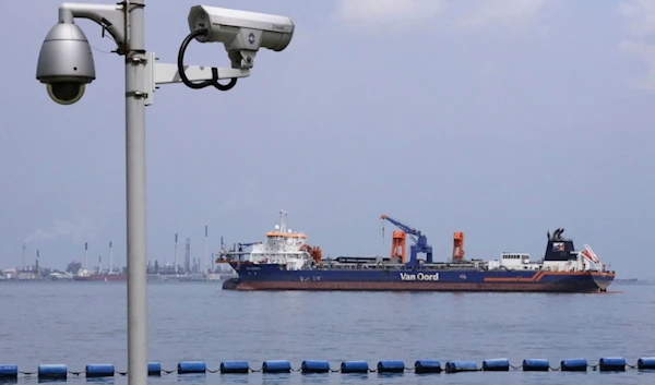 Netherlands-flagged dredger Vox Maxima is seen anchored off the coast in Sentosa Island in Singapore, Sunday, June 16, 2024. (AP)