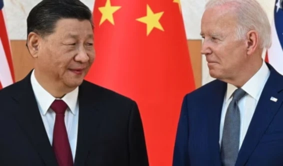 China’s president Xi Jinping and Joe Biden meet at the G20 summit in Bali, Indonesia, on 14 November 2022. (AFP/Getty Images)