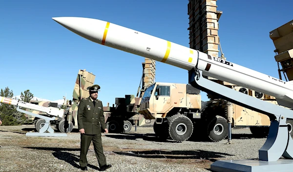 on Saturday, Feb. 17, 2024, Defense Minister Gen. Mohammad Reza Gharaei Ashtiani reviews the domestically built Arman air defense system (Iranian Defense Ministry via AP)