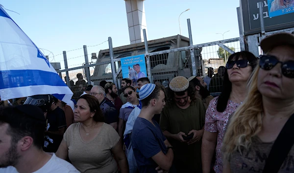 Protesters gather in support of soldiers being questioned for detainee abuse, outside of the Sde Teiman military base, on July 29, 2024. (AP)