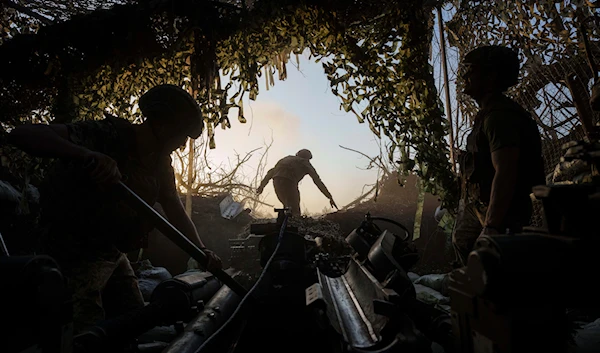 Ukrainian servicemen prepare a M777 howitzer to fire towards Russian positions at the frontline in Donetsk region, Ukraine, Wednesday, August 21, 2024. (AP)