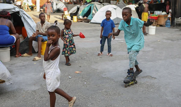 Children play at a gym converted into a makeshift shelter for people displaced by gang violence in Port-au-Prince, Haiti, Thursday, Aug. 15, 2024. (AP)