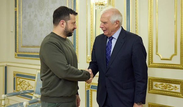 Ukraine's President Volodymyr Zelensky shaking hands with EU's High Representative for Foreign Affairs and Security Policy Josep Borrell prior to their talks in Kiev, February 7, 2024. (AFP)