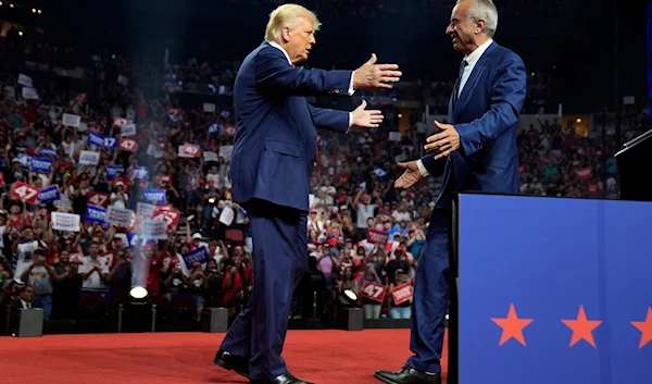 Republican presidential nominee former President Donald Trump embraces Independent presidential candidate Robert F. Kennedy Jr. after getting his endorsement at a campaign rally, Friday, August 23, 2024, in Glendale, Arizona (AP)