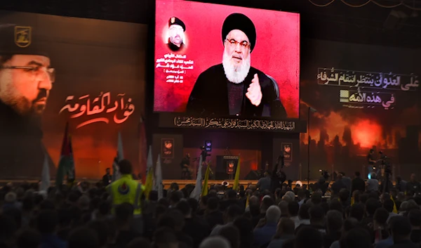 Hezbollah leader Sayyed Hassan Nasrallah speaks to his supporters through a screen, during a ceremony to commemorate the death of top commander Fouad Shukur, who was killed by an Israeli airstrike last week, in Beirut, Lebanon, Tuesday, Aug. 6, 2024. (AP)