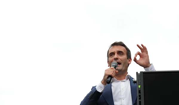 Far-right politician Florian Philippot adresses the crowd during a rally against the health pass, Saturday, Aug. 21, 2021 in Paris. (AP)