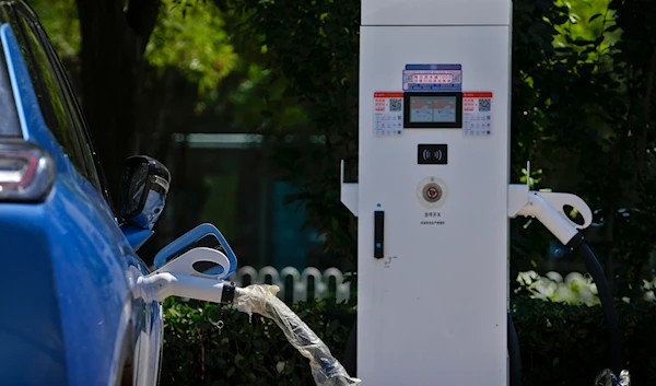 A Chinese electric vehicle charges at an electric vehicle charging station in Beijing, Monday, June 24, 2024. (AP)