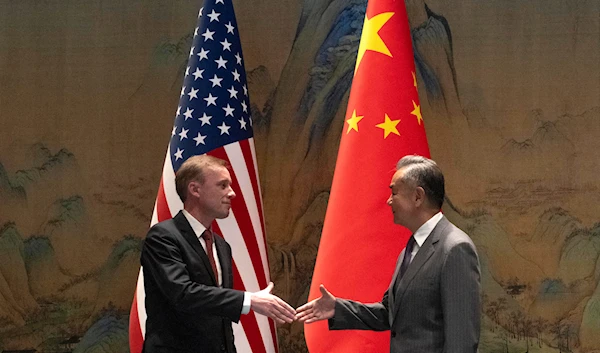 Wang Yi shakes hands with Jake Sullivan before their talk at Yanqi lake in Beijing, Tuesday, Aug. 27, 2024. (AP)