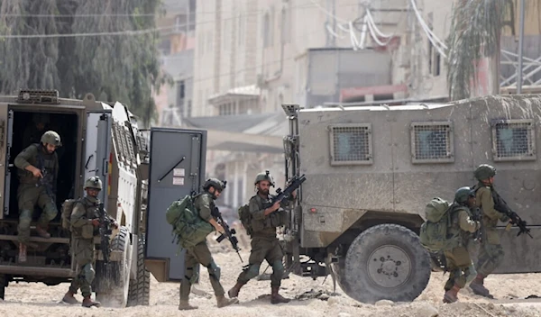 Israeli soldiers during a raid in the Nur Shams camp near the city of Tulkarem in the West Bank on August 28, 2024 (AFP)