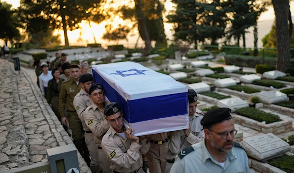 Israeli Navy sailors carry the flag-draped coffin of Petty Officer 1st Class David Moshe Ben Shitrit, who was killed on a Hezbollah attack, during his funeral at the Mount Herzl military cemetery in occupied al-Quds, on August 25, 2024. (AP)