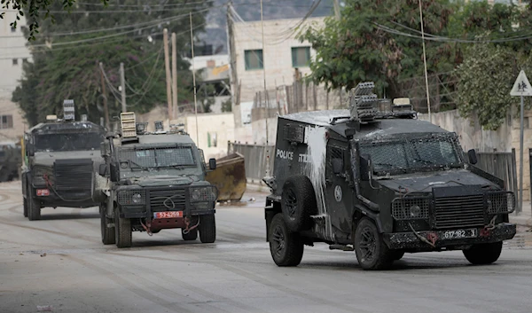 Israeli armoured vehicles move on a street during a military operation in the West Bank city of Jenin, on August 28, 2024.  (AP)