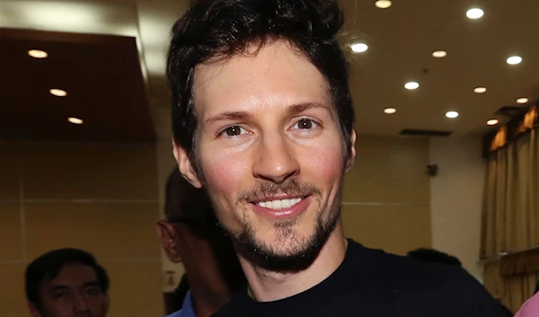 Telegram co-founder Pavel Durov, center, smiles following his meeting with Indonesian Communication and Information Minister Rudiantara in Jakarta, Indonesia on August 1, 2017. (AP)