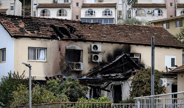 A damaged building in "Kiryat Shmona" as a result of a rocket attack by Hezbollah. (AFP).