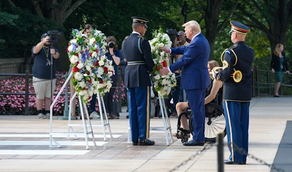 Former US president Donald Trump attends a wreath-laying ceremony at Arlington National Cemetery on August 26, 2024. (AFP)