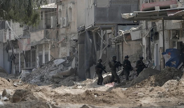 Israeli occupation soldiers patrol a street during the invasion of the West Bank refugee camp of Nur Shams, Tulkarm, Thursday, Aug. 29, 2024. (AP)