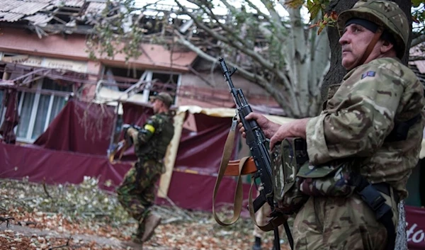 Ukrainian government soldiers from battalion "Donbass" search from house to house in village Mariinka near Donetsk, eastern Ukraine, Monday, Aug. 11, 2014. (AP)