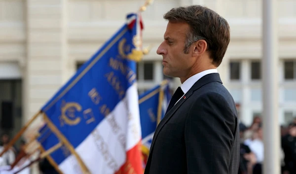 French President Emmanuel Macron attends a ceremony to mark the 80th anniversary of the police Prefecture liberation in Paris, Monday Aug. 12, 2024. (Alain Jocard, Pool via AP)