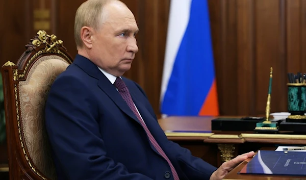 Russian President Vladimir Putin listens to Astrakhan region governor Igor Babushkin during their meeting at the Kremlin in Moscow, Russia, Tuesday, Aug. 27, 2024. (AP)