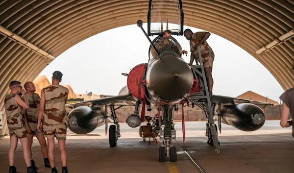 French Barkhane Air Force mechanics maintain a Mirage 2000 on the Niamey, Niger base, on June 5, 2021. (AP)